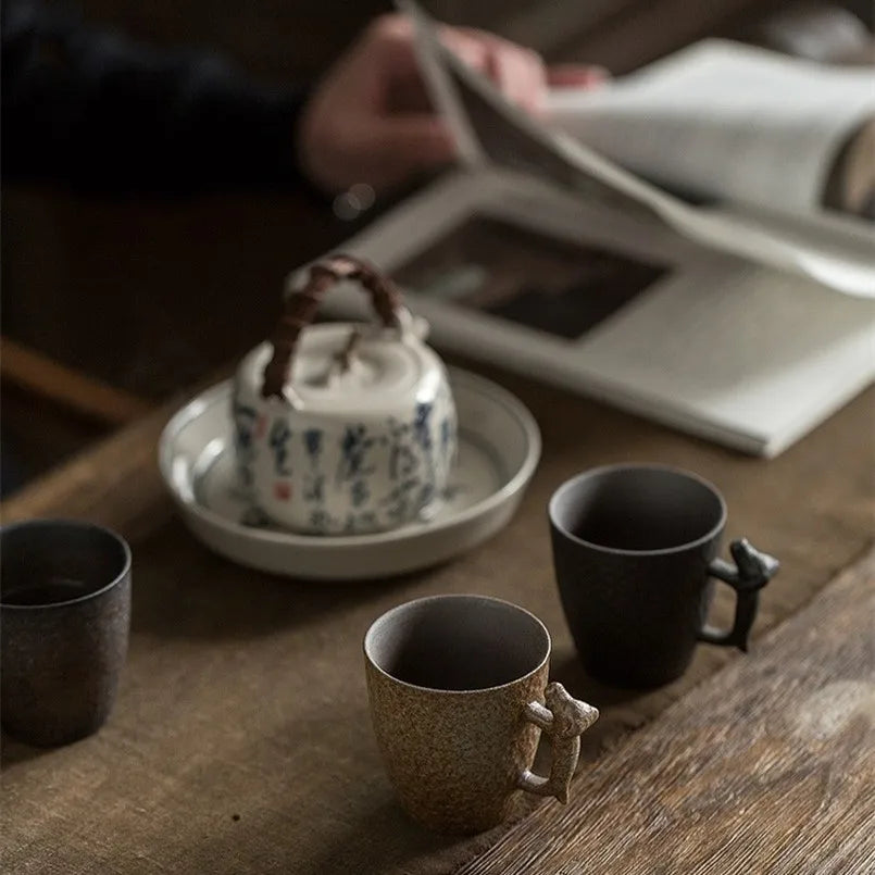 Enjoy your espresso with our Japanese Retro Ceramic Coffee Dog Mug. Handmade, with a whimsical dog-shaped handle and durable ceramic, perfect for coffee lovers.