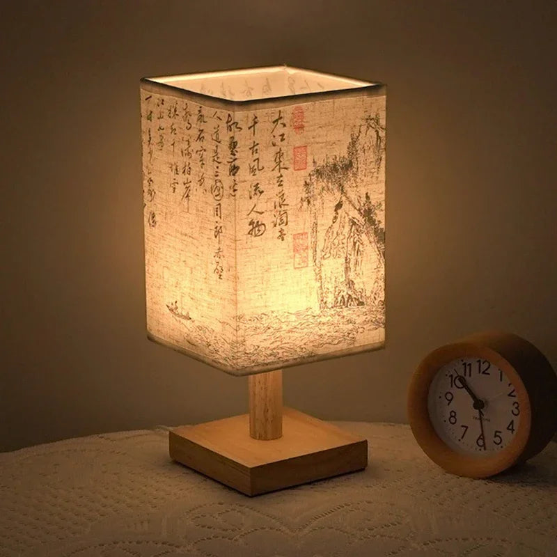 This Chinese Style Table Lamp adds cultural elegance to your space with a fabric lampshade that emits warm, inviting light. USB-powered and easy to use with a button switch.