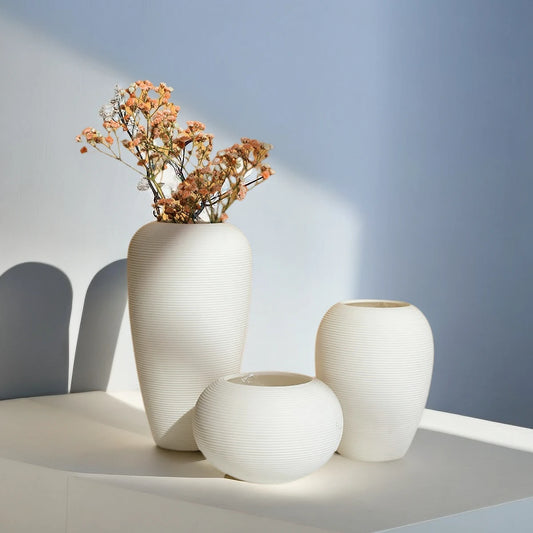 Discover our Modern Decorative Nordic Ceramic Vase collection. Sleek, minimalist design, durable ceramic, perfect for showcasing blooms.