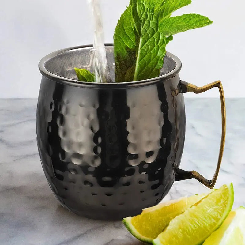 Elevate your drinks with the Hammered Stainless Steel Cocktail Mug. Durable, elegant with a gold handle, non-slip base, and vintage drum style—perfect for any libation.