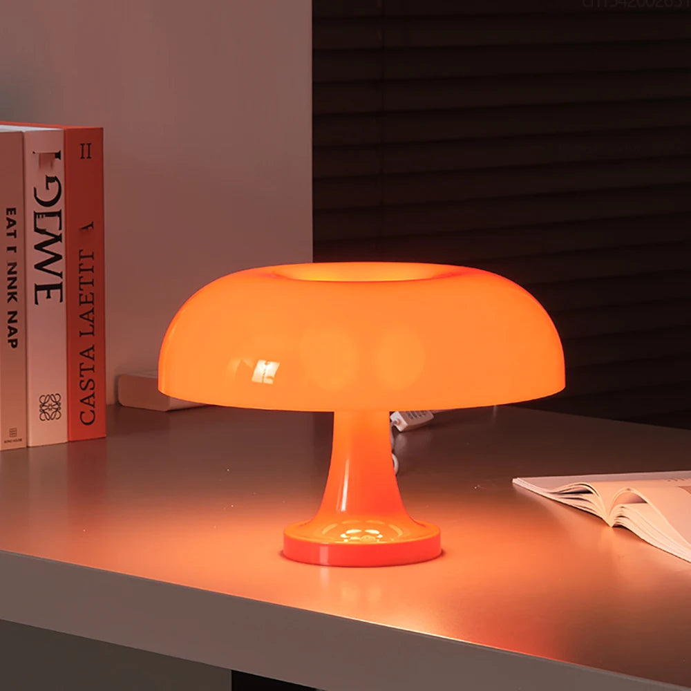 Illuminate your space with the Bauhaus Mushroom Table Lamp. Featuring a minimalist design, dimmable light, and durable PVC construction, available in vibrant orange and elegant white.