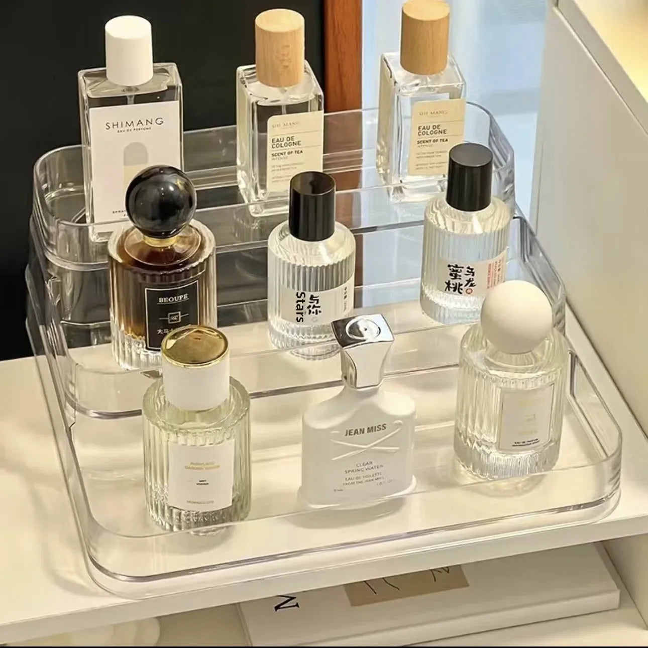 Organize in style with this durable acrylic three-layer storage rack. Perfect for showcasing perfumes, cosmetics, or accessories, adding elegance to any space!