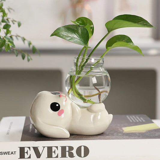 Introduce kids to gardening with our Bunny Rabbit Hydroponic Vase, featuring a cute ceramic bunny and platform. Perfect for growing plants, it adds a playful touch to any space.