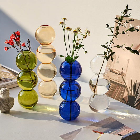 Discover our modern Glass Vase, crafted from transparent glass with a sleek bubble ball design. Perfect for chic dining room decor.