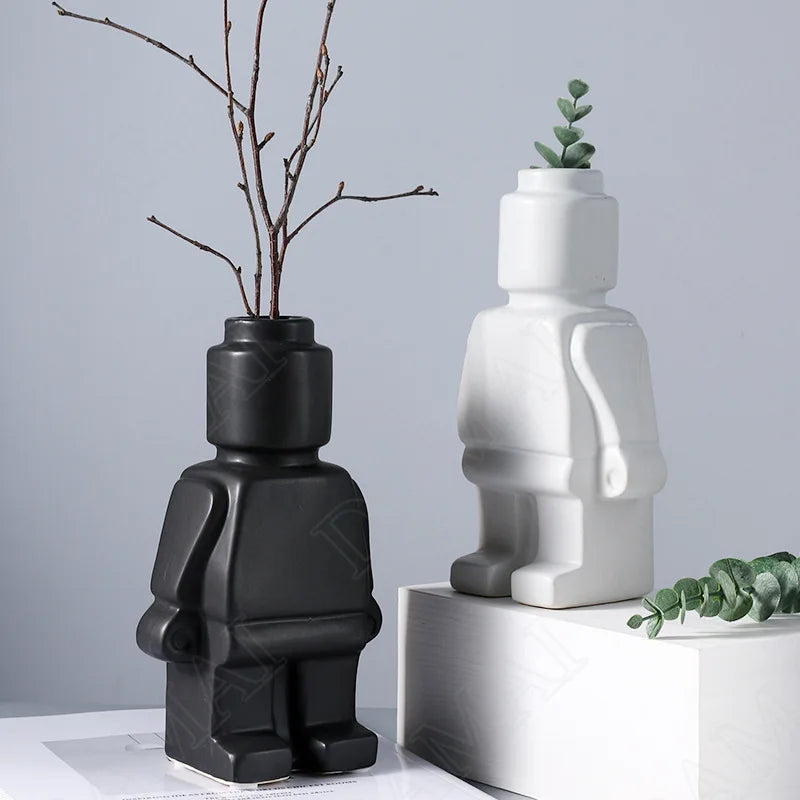 The Resin Lego Character Vase is a durable, playful decor piece. Perfect for Lego lovers, it adds charm to any space and is great for flowers or as a standalone piece.