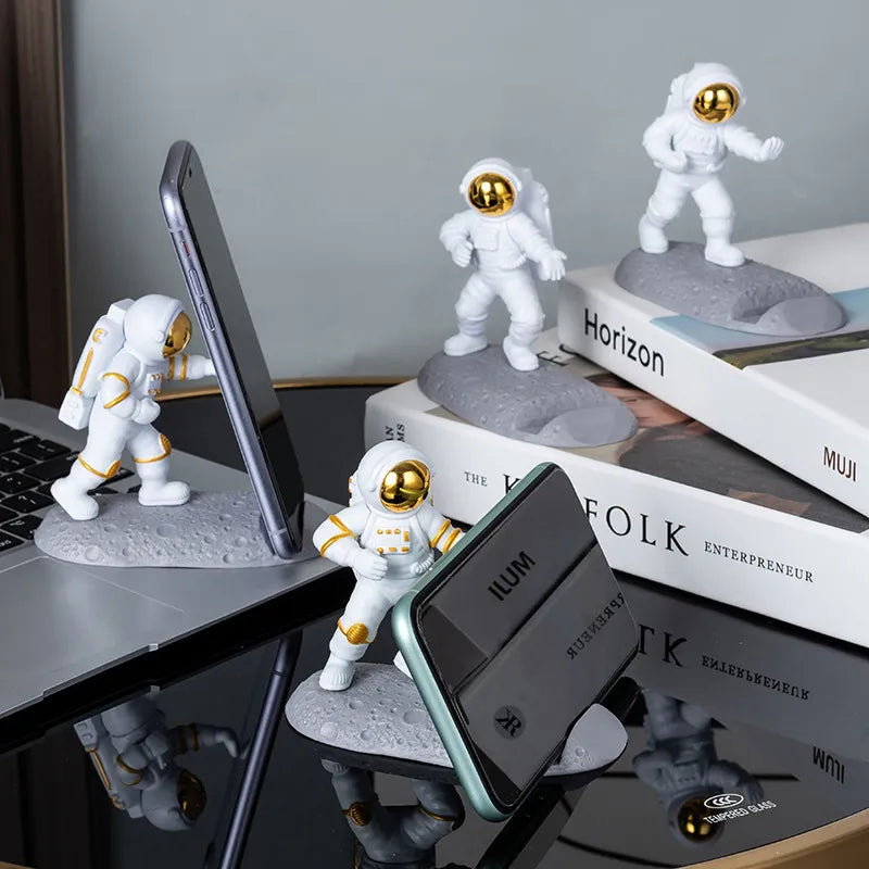 Add cosmic flair to your desk with the Astronaut Mobile Phone Stand Holder. This space-themed sculpture is both a functional smartphone bracket and a unique decoration.