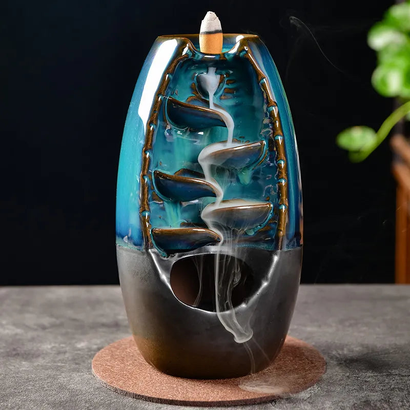 Experience tranquility with our Ceramic River in Mountain Incense Burner. Designed for cone incense, its polished finish and intricate design evoke serene mountain beauty.