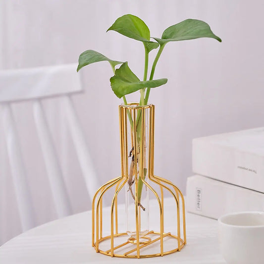 Enhance your decor with gold wrought iron vases featuring sleek test tube containers. Perfect for fresh flowers or plant clippings, adding elegance to any space.