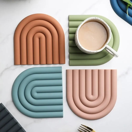 Elevate your kitchen with our Rainbow Silicone Coaster Set, dual-purpose as heat-resistant pot holders. Crafted from durable silicone for style and functionality.