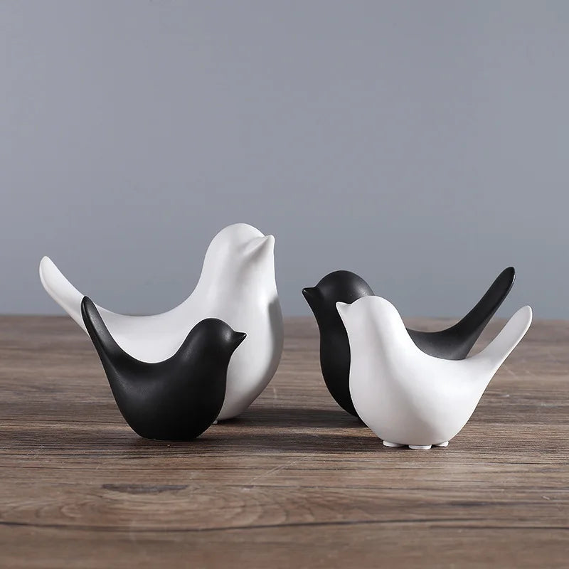 Elevate your decor with Nordic Ceramic Bird Figurines. Available in four sizes, these black and white statues double as stylish jewelry holders, blending minimalism with functionality.