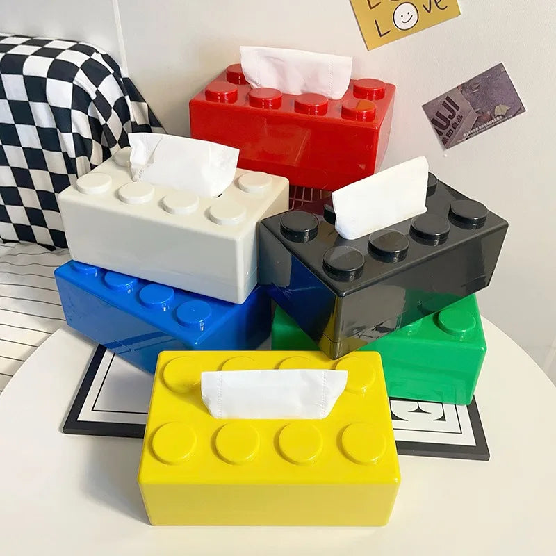 Add a playful touch to any room with this building block-inspired tissue box. Durable ABS plastic, compact design, and a spring mechanism for smooth tissue access!