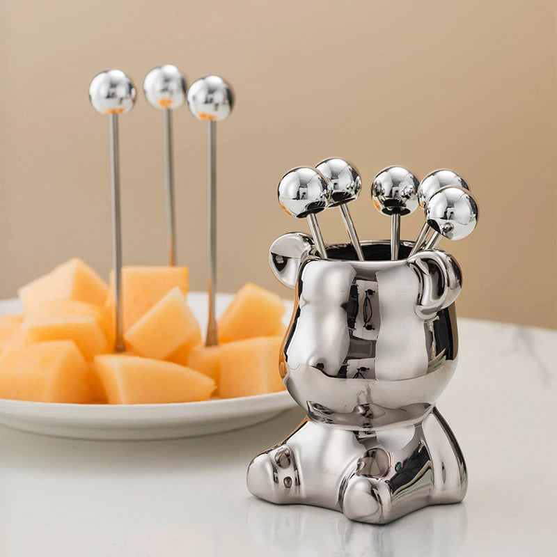 Charming bear-shaped storage jar with 6 stainless steel fruit forks. Ideal for fruits, snacks, and desserts. A perfect gift for any occasion, combining style and functionality.