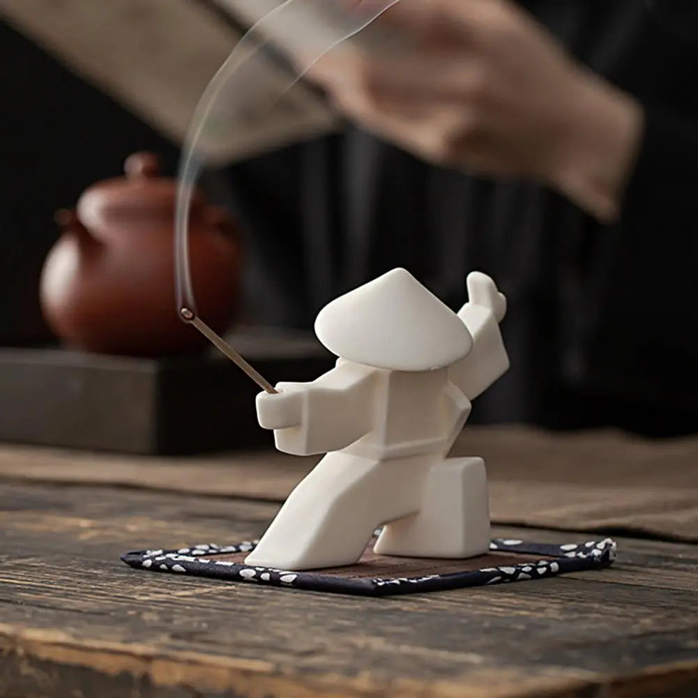 Elevate your space with our Chinese Swordsman Incense Burner. Crafted from white porcelain, it combines elegance and tranquility, perfect for any serene setting.