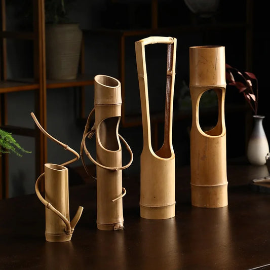 Enhance your decor with the Japanese Bamboo Tube Vase, handcrafted from sustainable bamboo. Combining traditional craftsmanship with modern aesthetics, it adds elegance and sophistication to any room. Ideal for flowers or as a decorative piece.