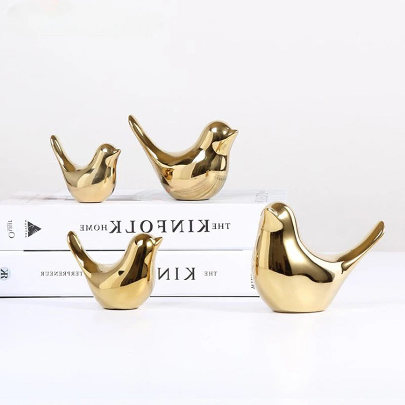 Elevate your decor with our Nordic Ceramic Bird Figurines in gold. Available in four sizes, these stylish pieces double as jewelry holders, blending luxury and functionality.