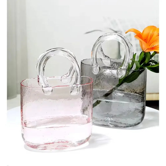 Handbag-shaped glass vase for fresh flowers or goldfish. Chemical-free, colorful, and perfect for home decor or gifts. Ideal for birthdays and housewarmings.