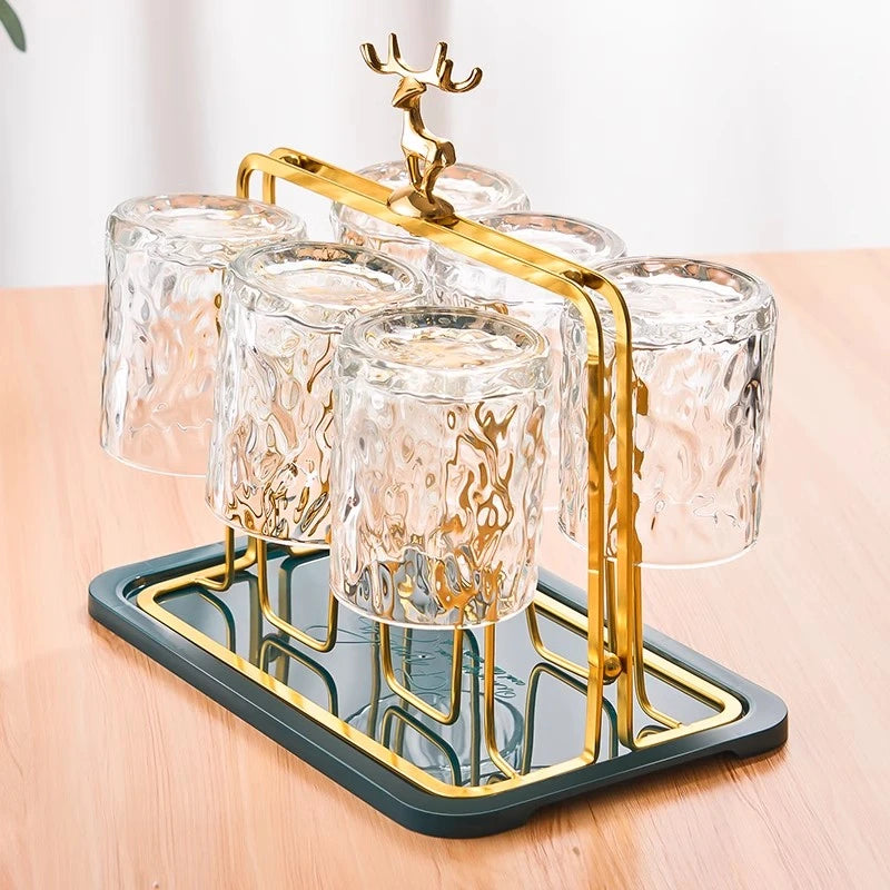 Discover our Artisan Metal Glass And Cup Holder, blending elegance with functionality. Crafted from high-quality metal with an intricate elk motif, it's perfect for hosting and enhancing your home decor.