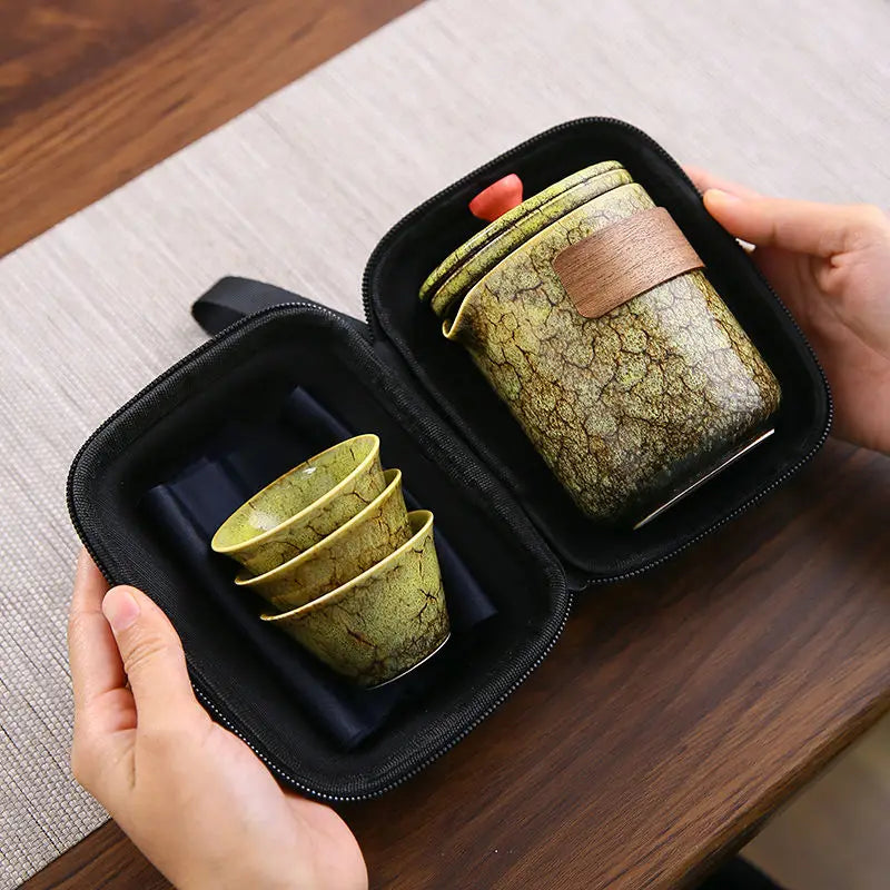 Elevate your tea experience with our Travel Gift Tea Set. Handcrafted ceramic, built-in tea filter, and stylish carry bag make it perfect for on-the-go tea lovers.