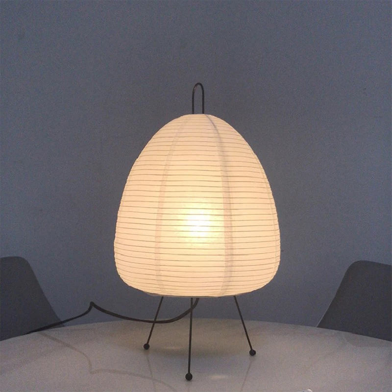 Elegant desk lamp with an iron tripod and handmade rice paper shade. E27 LED bulb, 28 cm diameter, 47 cm height. Ideal for 5-10 m² spaces. Wabi-Sabi style.