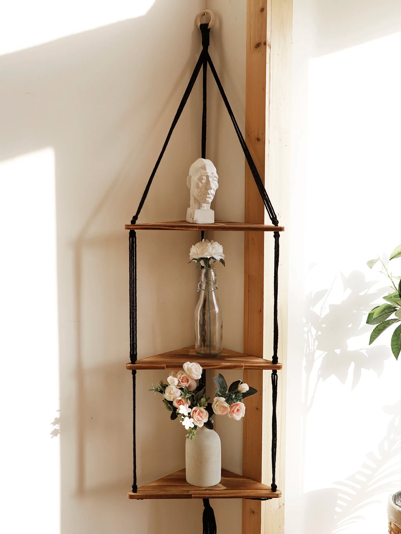 Elevate your space with our Wooden Corner Shelf featuring a boho macrame design. Ideal for pots, books, and decor, it combines Nordic charm with functionality.