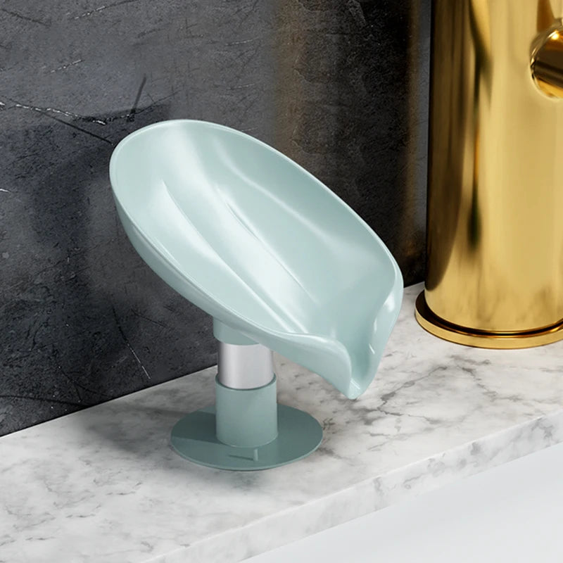 Upgrade your bathroom with our Leaf-Shaped Suction Cup Soap Organizer Shelf. Made from high-quality, BPA-free ABS, it keeps soap dry with a 45-degree tilt design and is easy to install and clean.