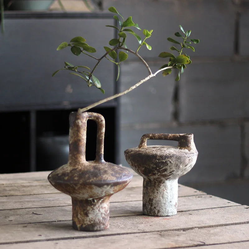 This handmade cylindrical vase, available in two heights, adds a rustic farmhouse touch to any decor. Perfect for flowers, hydroponic plants, or pampas grass.