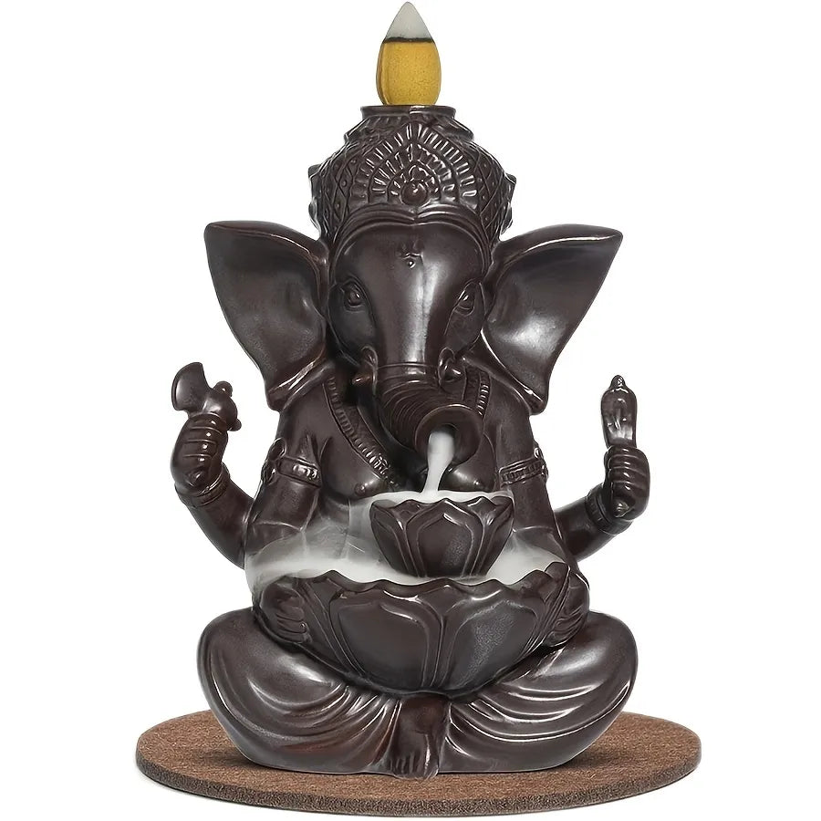 Elevate your space with our Porcelain Ganesha Incense Burner. Featuring Ganesha’s iconic image, this piece creates a mystical aura with its flowing incense smoke.