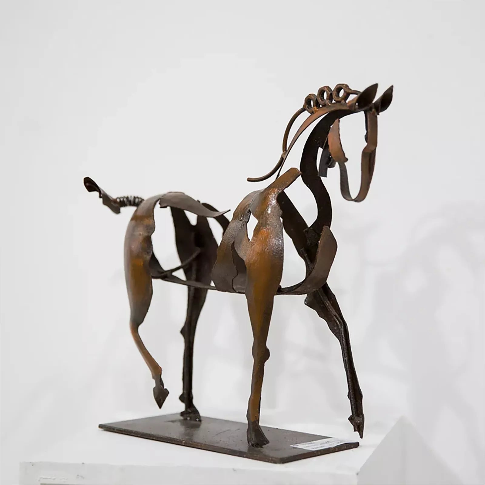 Enhance your decor with our Metal Horse Sculpture. This handmade craft features a hollow body design and old colors aesthetic, adding charm and elegance to any space.