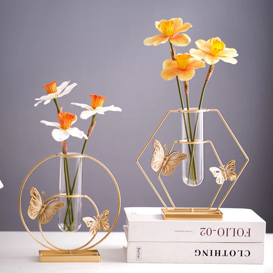 Elegant iron vase with golden glass insert and butterfly patterns. Ideal for flowers, perfect for home or office. Durable, luxurious gift for special occasions.